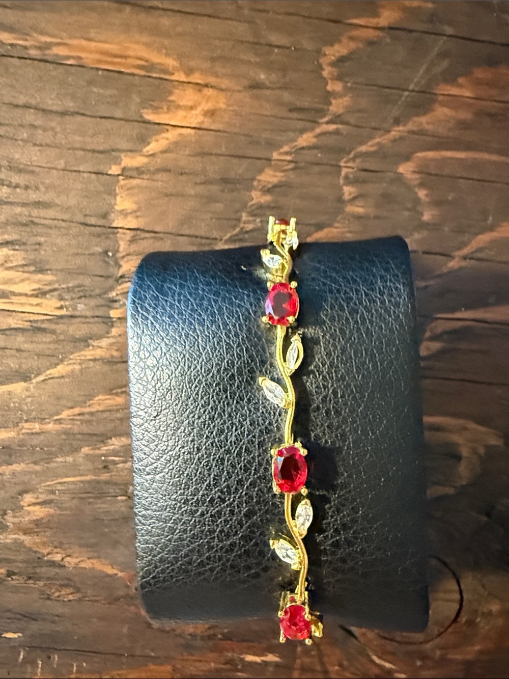 Gold Plated bracelet with red stones and leaf design